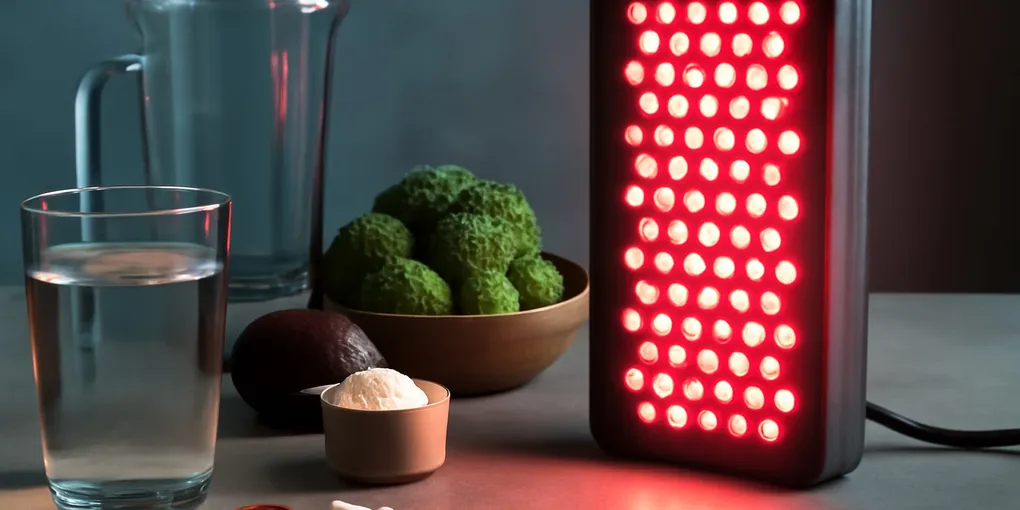 Red light therapy panel for muscle recovery in home gym with no visible text